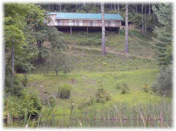 Summer view of Guest House from pond